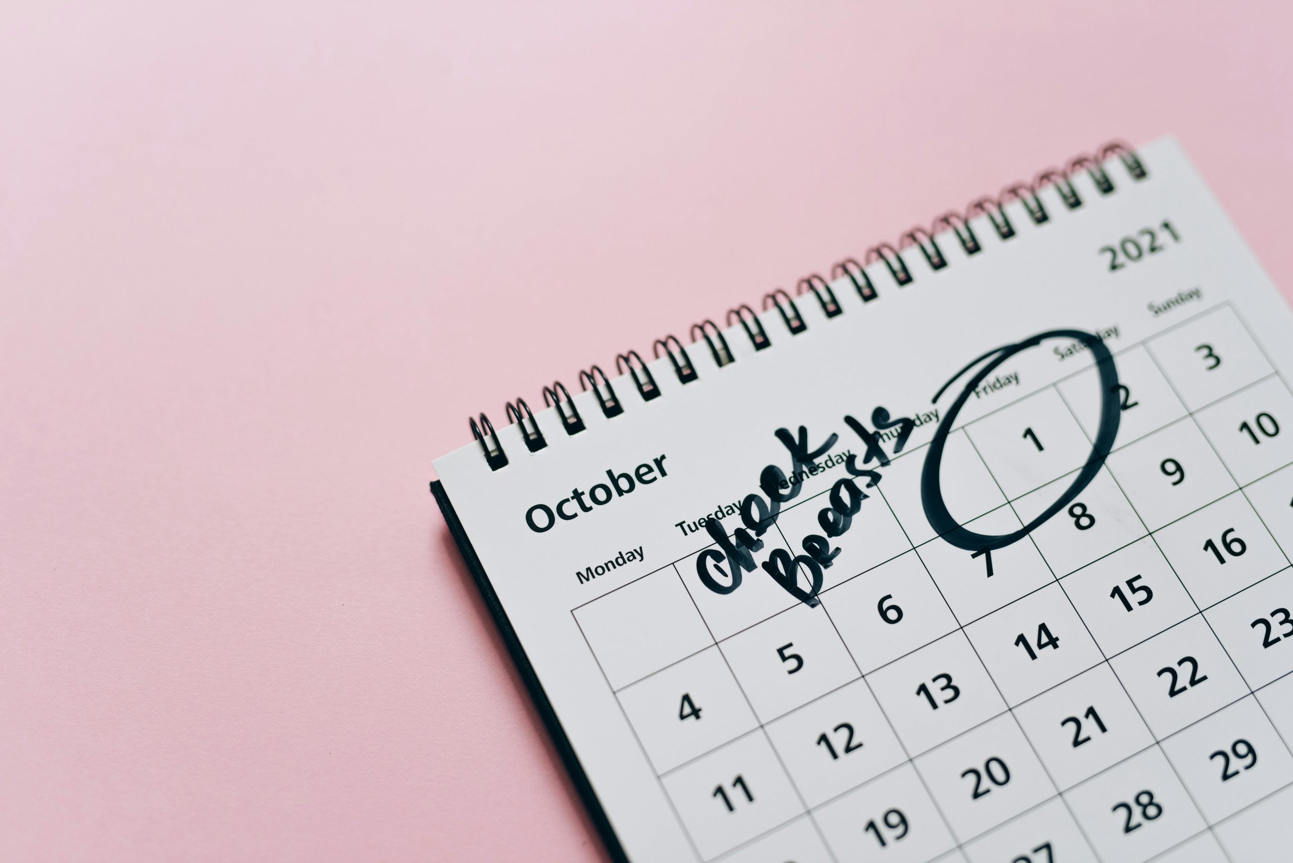 Habit tracker calendar view marking completed days with colorful checkmarks