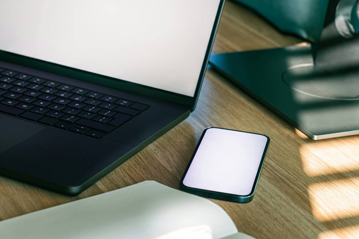 Photo of Jessica smiling next to her completed projects board